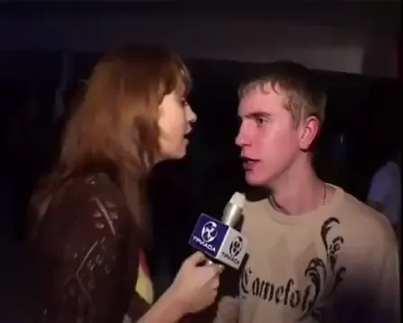 Video: a street-interview clip outside a nightclub, a reporter holds a microphone up to a wide-eyed young man in a "Camelot" shirt, the classic stunned-interviewee reaction